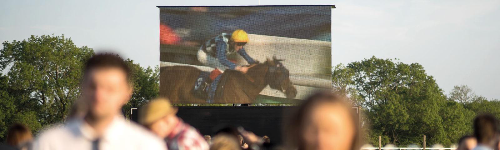 A view of the course-side video wall on raceday.