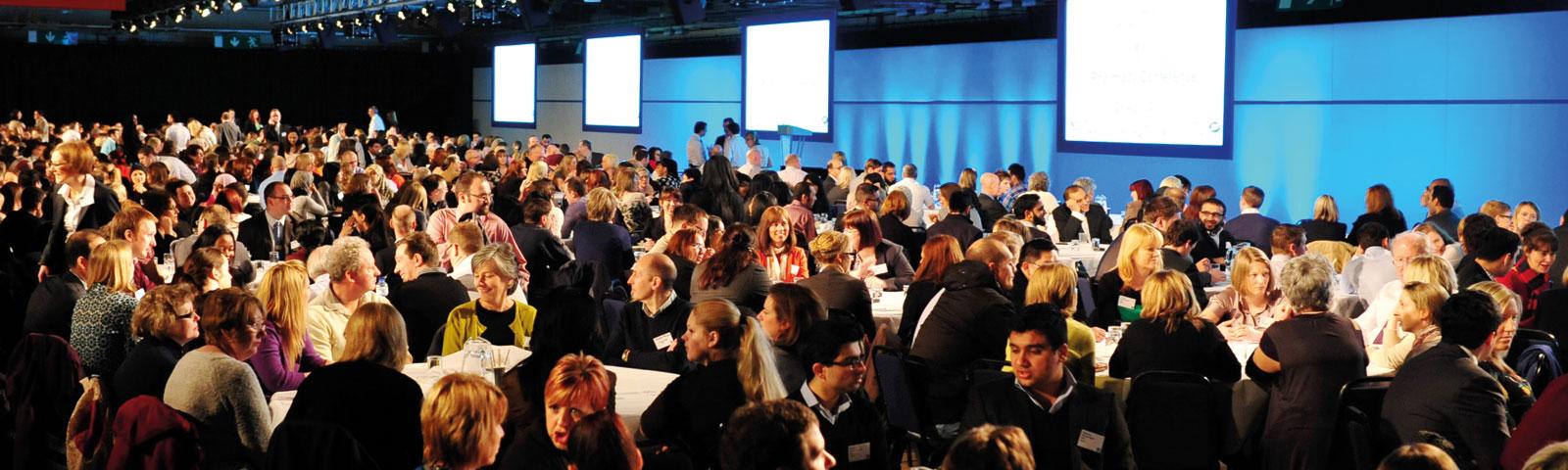 Crowds attending a conference.