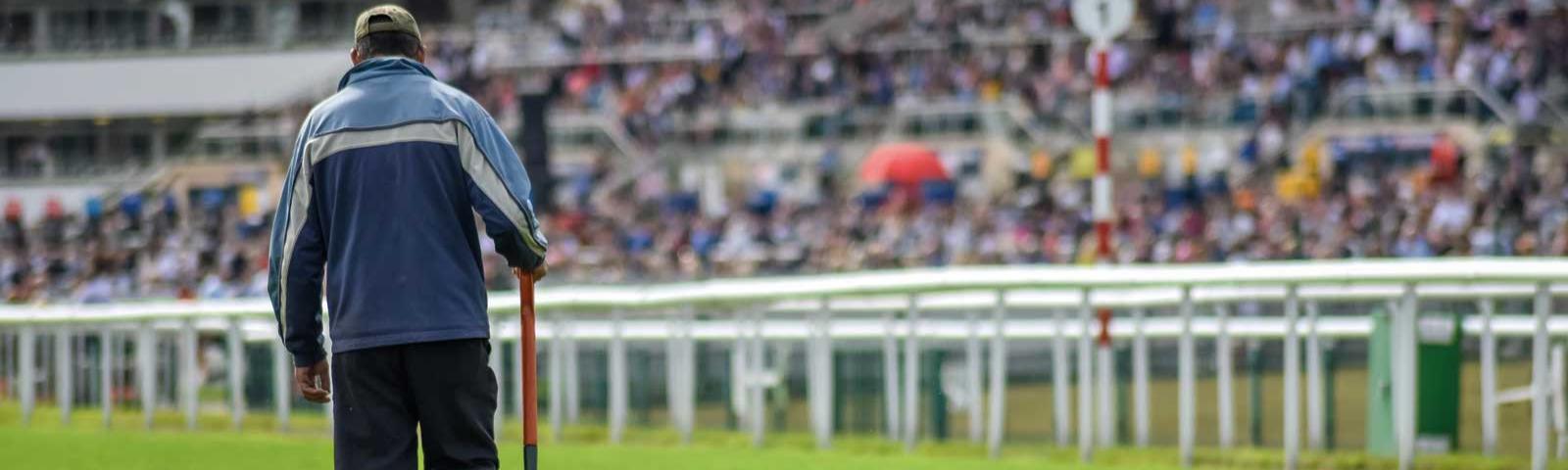 Man walking on race track.